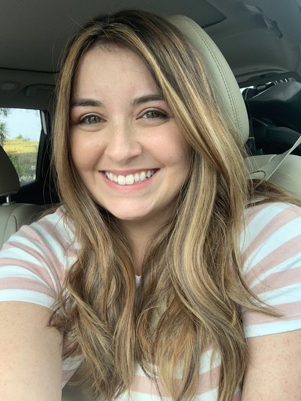 A happy client with sun-kissed color and a fresh style